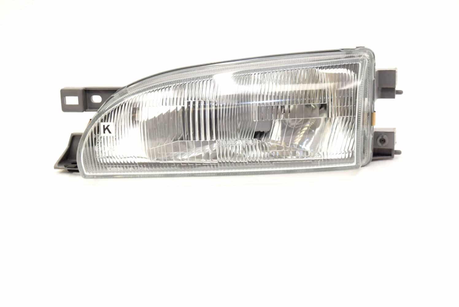 84001FA090 Lampa przednia lewa OEM Subaru Impreza GC8 94-96