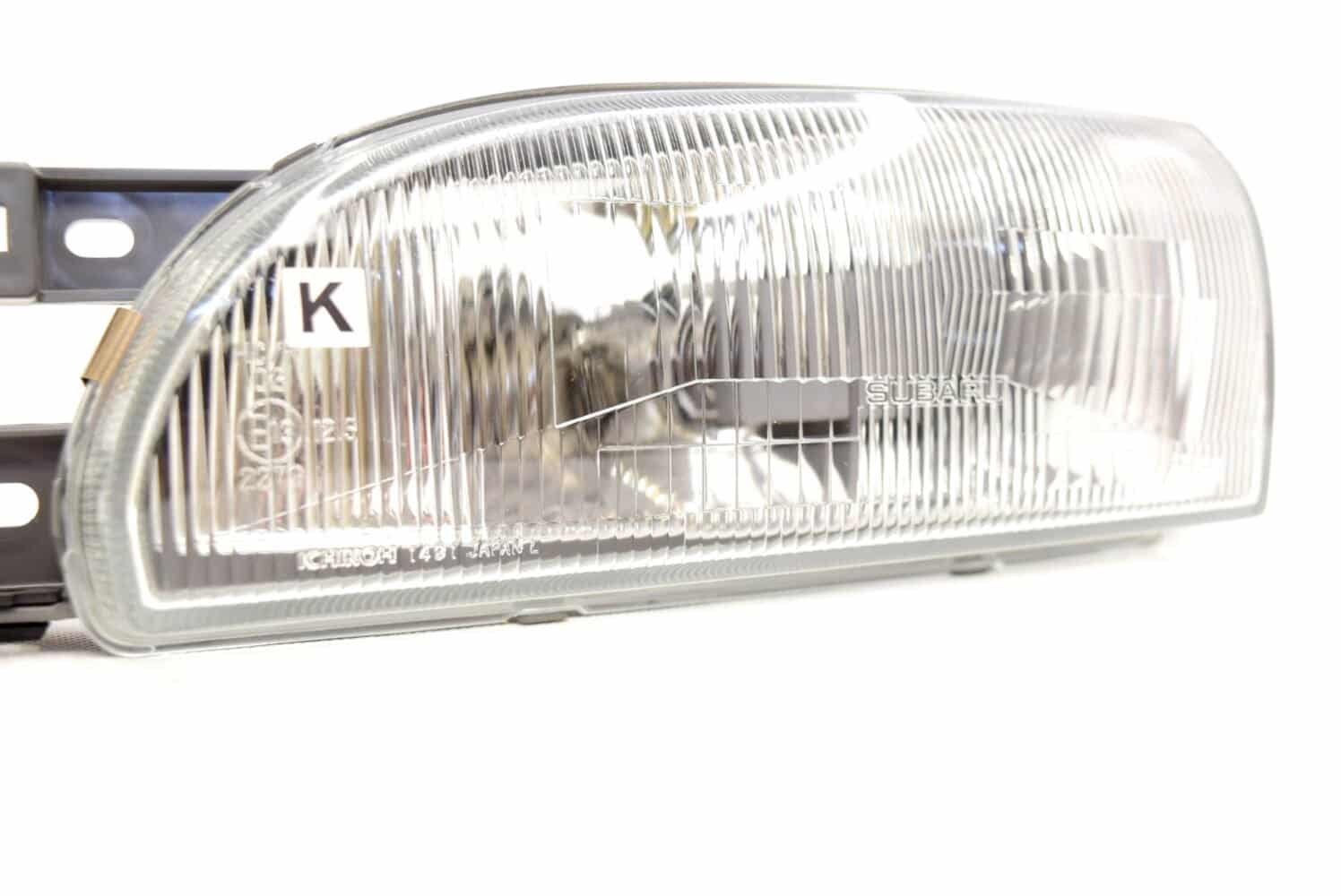 84001FA090 Lampa przednia lewa OEM Subaru Impreza GC8 94-96